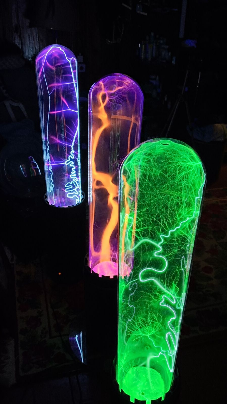 Violet, orange and green plasma tubes